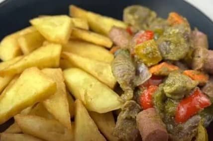 Fried yam with gizzard and sausage