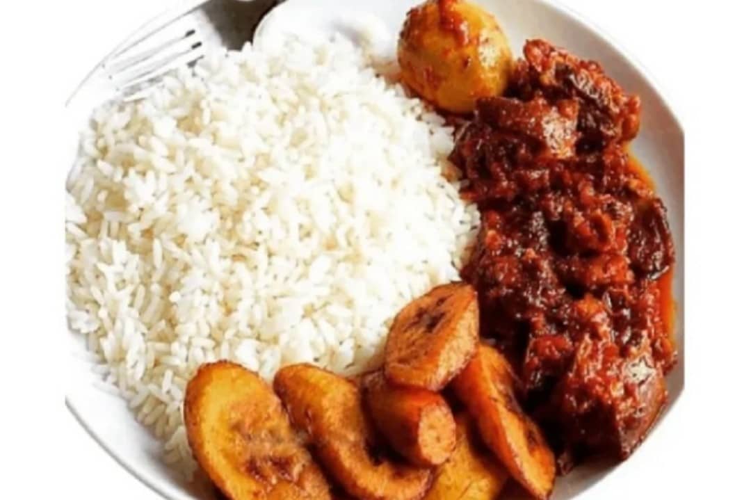 white rice and peppered stew with Plantains