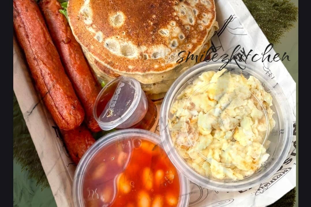 Pancake or Waffles with Scrambled eggs Baked beans Drumsticks and Sausage