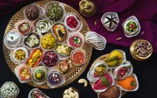 Assorted mithai platter from the 24 Carats Sweets online store, India