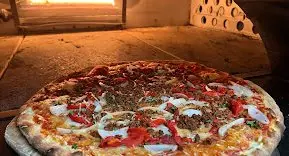 Pizza coming out of the oven at Bella Casa Vegana, New Haven, USA