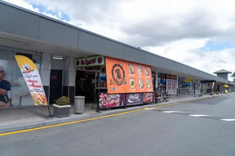 Big Charcoal Chicken storefront banner at Acacia Marketplace, Acacia Ridge, Australia