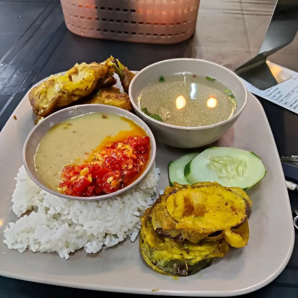 Nasi ayam gepuk with sambal, clear soup, cucumber and fried eggplant at Warung Kak Win, Malaysia